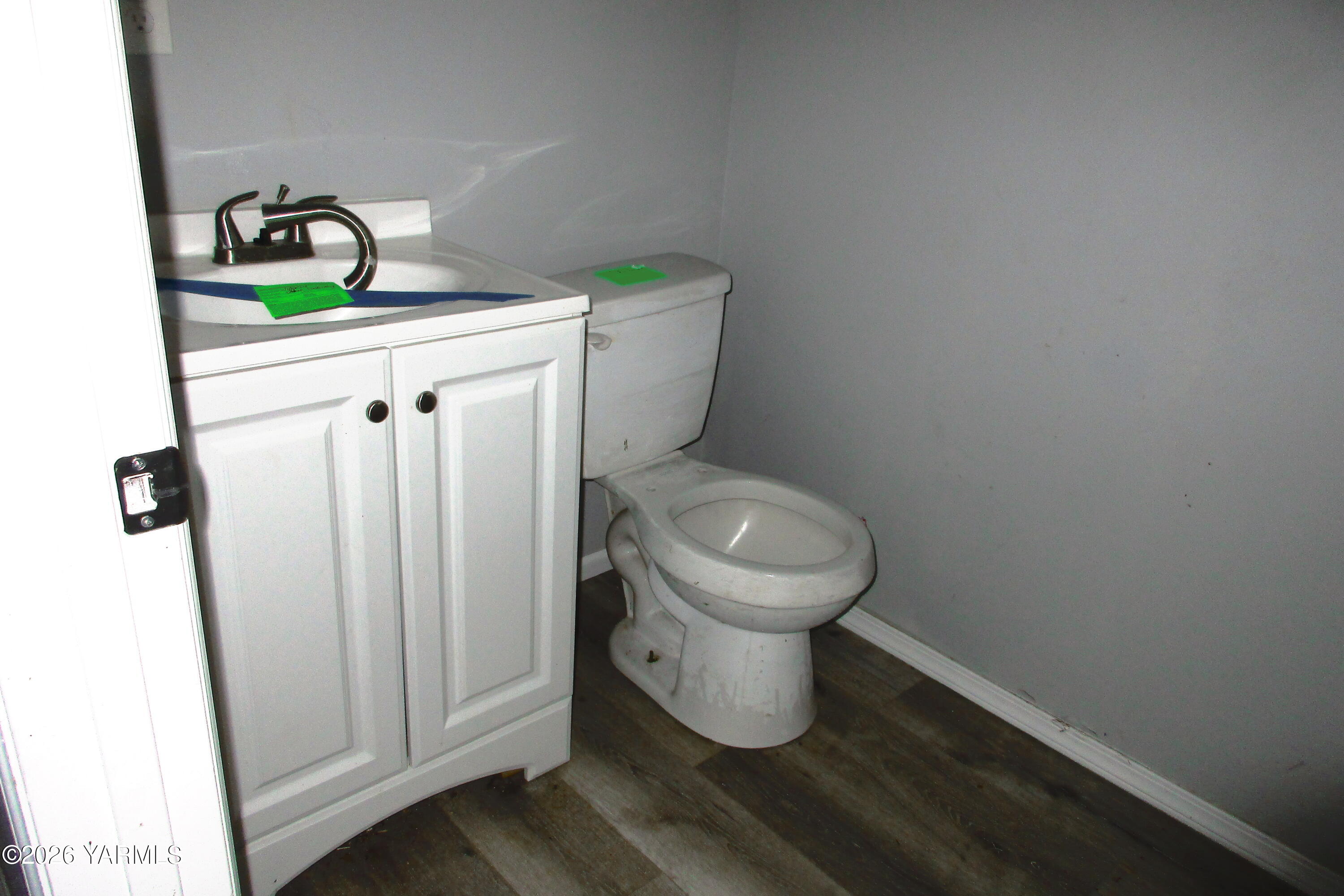 208 North Alder Street Toppenish, WA 98948 - Photo 12 of 14 a white toilet sitting next to a sink