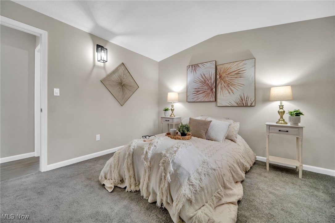 6320 Jaycox Road North Ridgeville, OH 44039 - Photo 21 of 34 Carpeted bedroom with baseboards and vaulted ceiling