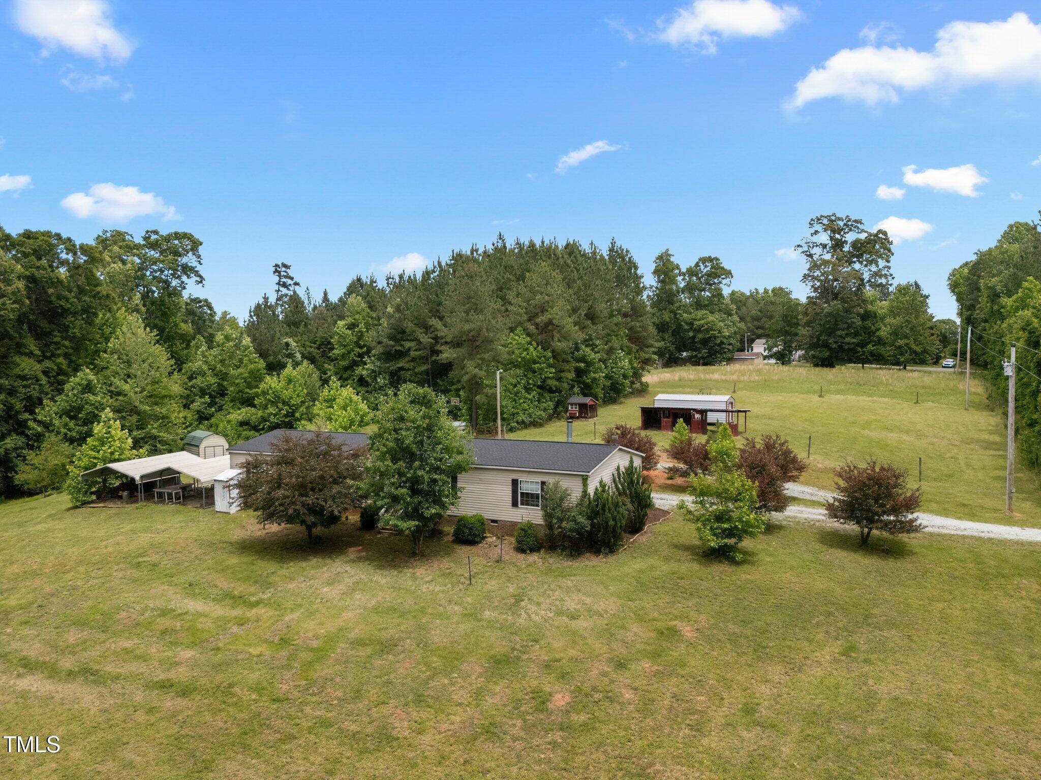 3415 Old Allensville Road Roxboro, NC 27574 - Photo 2 of 44 8-web-or-mls-DJI_20250522134817_0032_D