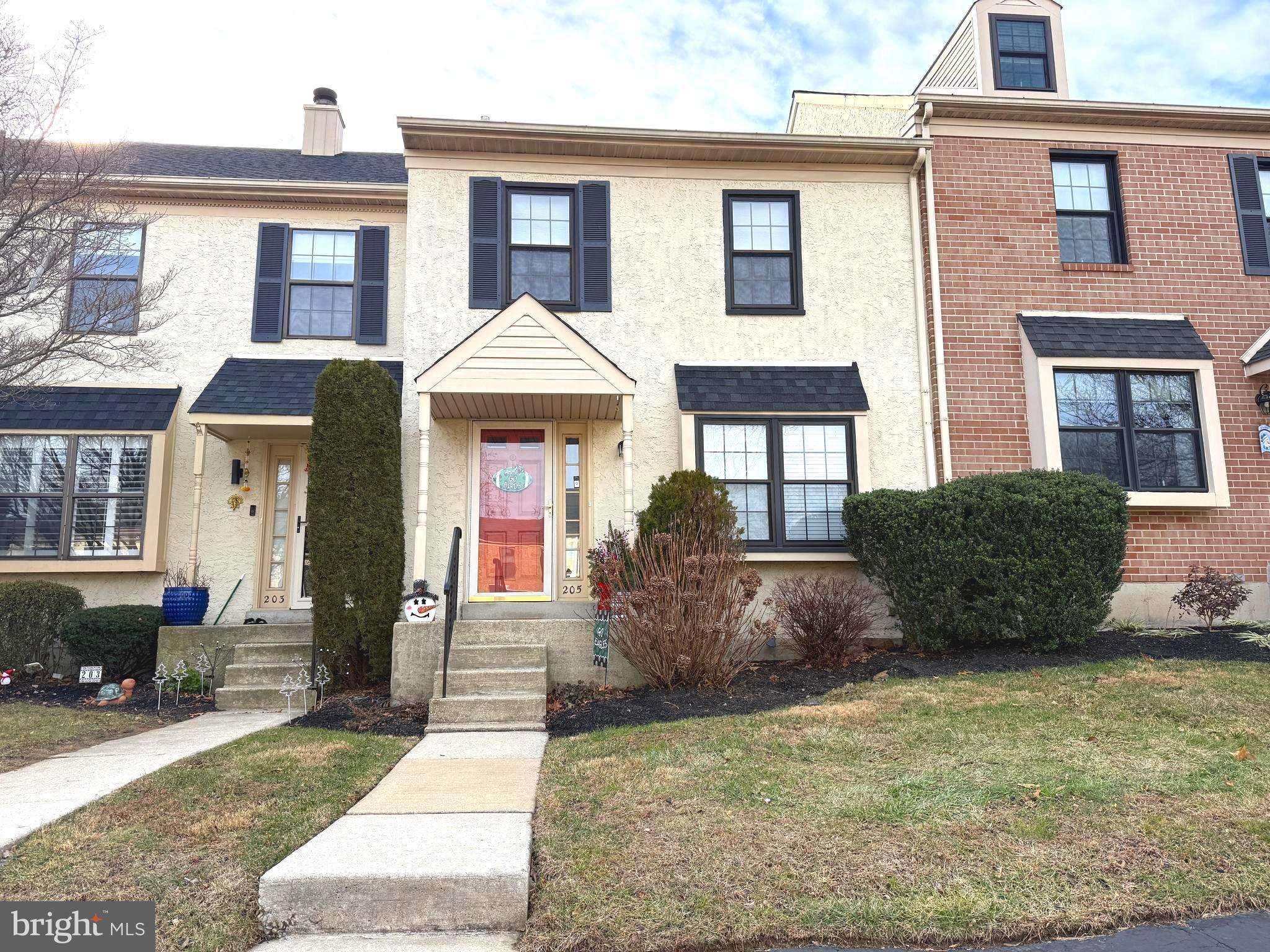 a view of a brick house with many windows