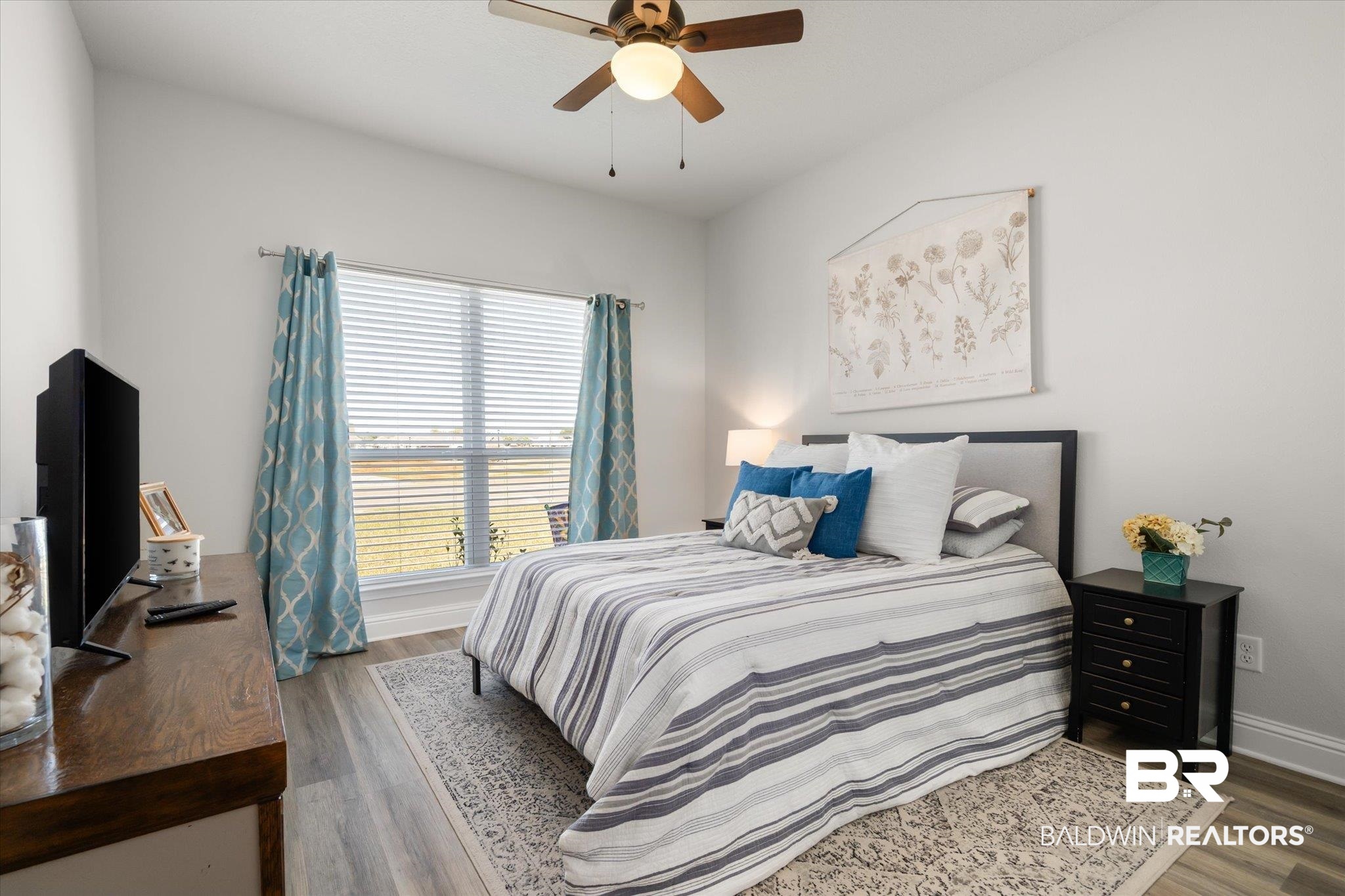 1167 Provision Road Mobile, AL 36608 - Photo 12 of 20 Bedroom with ceiling fan, baseboards, and wood finished floors