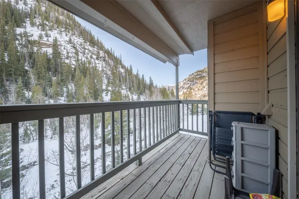 a view of a balcony with wooden floor