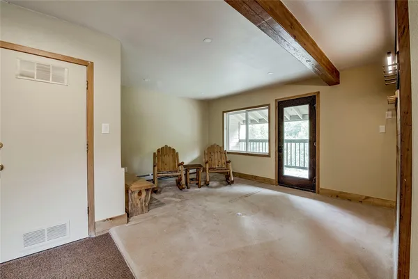 a view of workspace with furniture and window