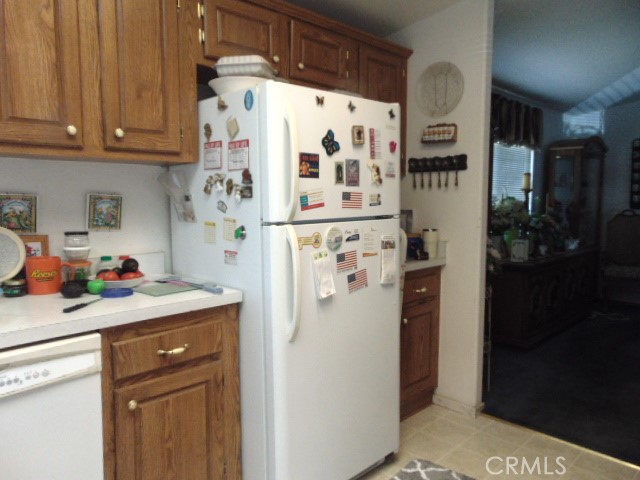 3835 Gardiner Ferry Road, Unit 62 Corning, CA 96021 - Photo 15 of 34 a kitchen with stainless steel appliances a refrigerator and cabinets