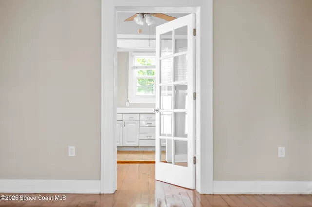 a view of living room with furniture and a floor to ceiling window