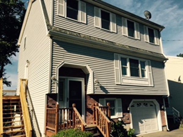 60 Valley Road Dracut, MA 01826 - Photo 1 of 15 a view of a house with more windows and stairs