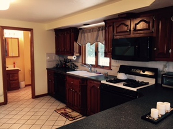 60 Valley Road Dracut, MA 01826 - Photo 3 of 15 a kitchen with a sink and a stove
