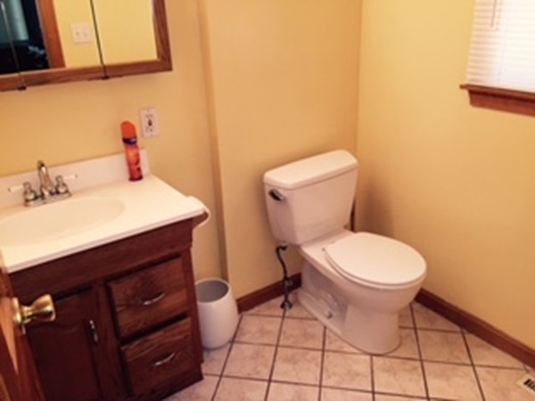 60 Valley Road Dracut, MA 01826 - Photo 10 of 15 a bathroom with a sink and a toilet