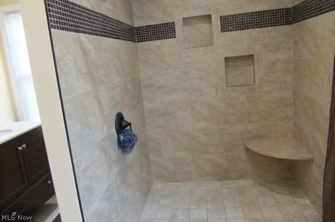 4515 Redfern Road Parma, OH 44134 - Photo 9 of 19 New 5ft x 5ft walk in spa Travertine tile shower with seat in 1st floor master suite.