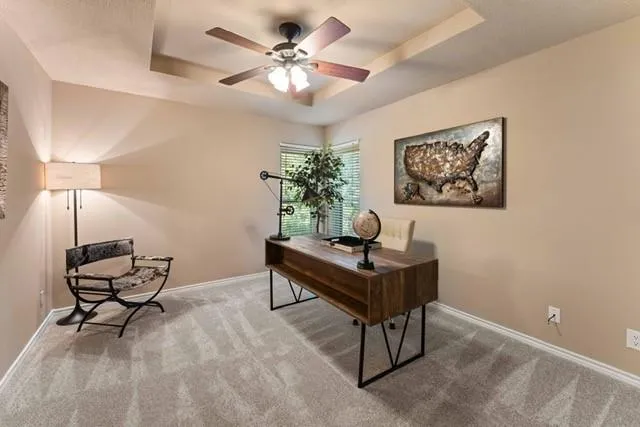 a living room with furniture and a lamp