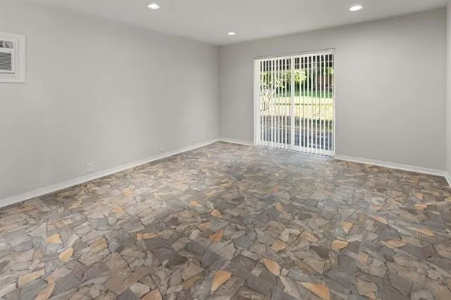 a view of an empty room with a window