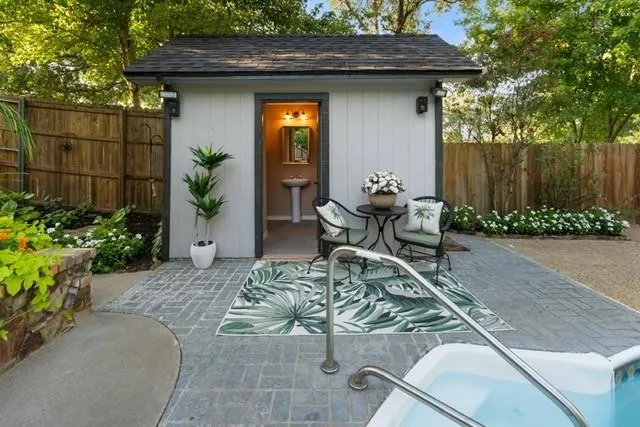 a patio with table and chairs