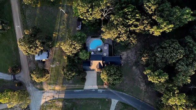 a view of a house with a yard and garden