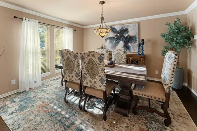 a view of a dining room with furniture window and outside view