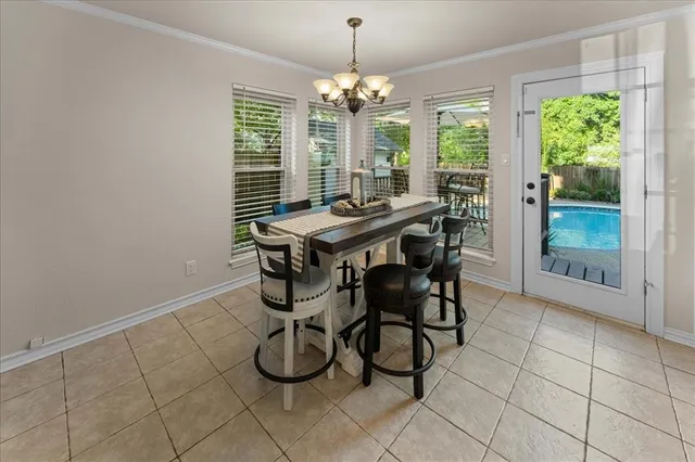 a view of a dining room with furniture window and outside view