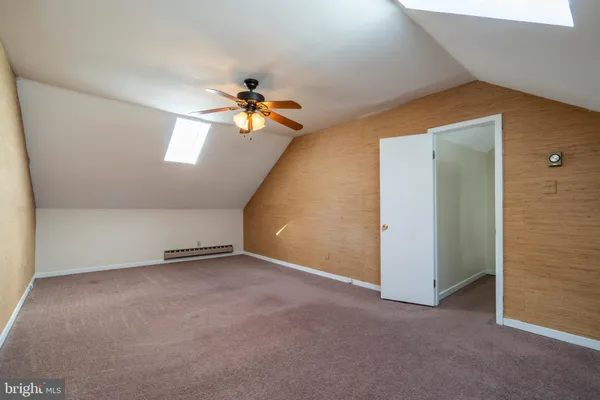a view of a big room with carpet