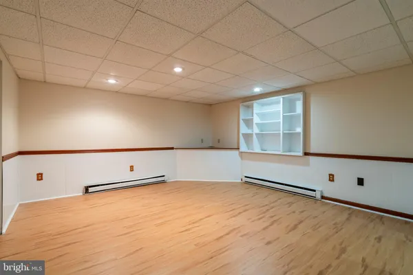 a front view of multiple houses with yard