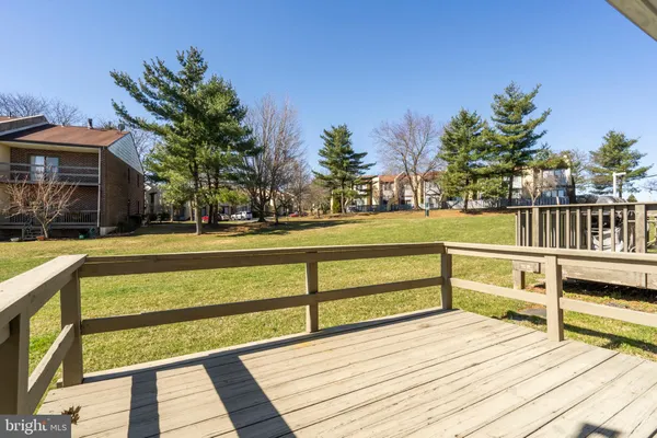 a view of a swimming pool with a bench and floor to ceiling window
