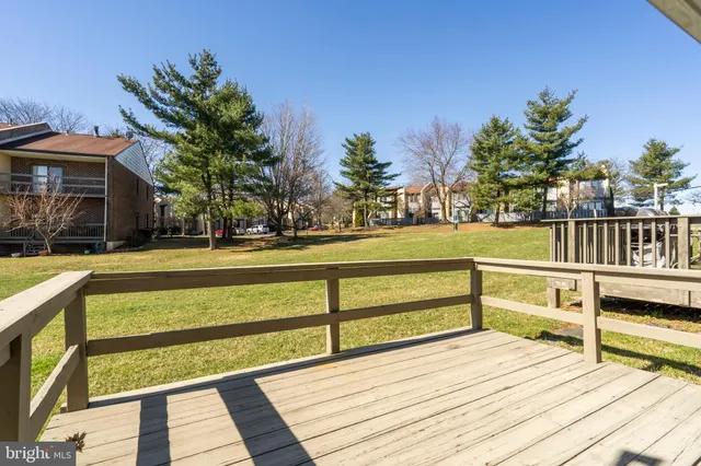 a view of a swimming pool with a bench and floor to ceiling window