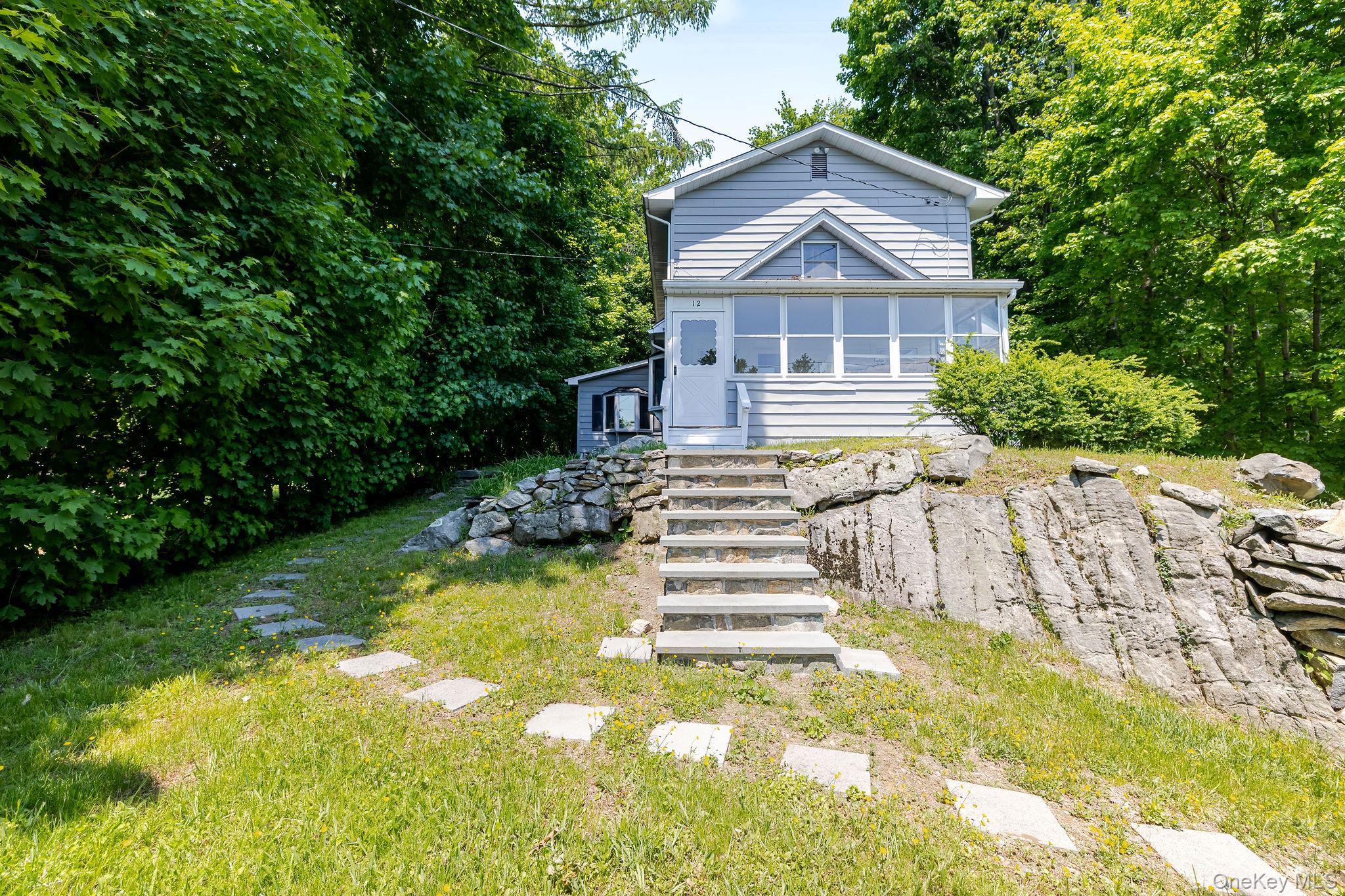 12 Bradhurst Road Carmel, NY 10512 - Photo 1 of 28 a view of house with a yard and large trees