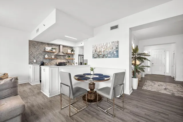 a living room with furniture a couch and a window