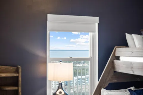 a view of room with window and front door