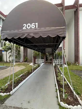 a view of a backyard of the house