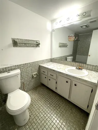 a room with a bed and a chair