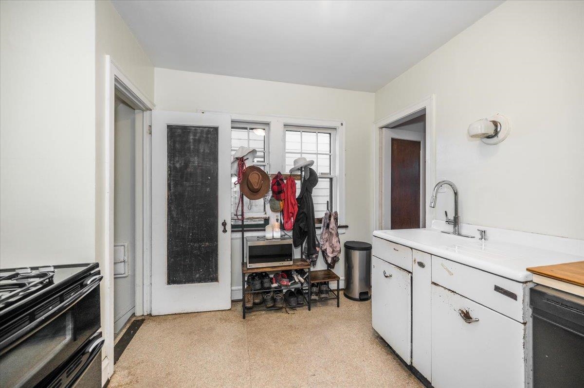 2202 Missouri Avenue Superior, WI 54880 - Photo 8 of 24 Kitchen with light countertops, black appliances, white cabinets, and light flooring