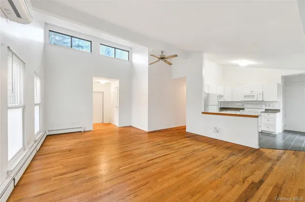 a bedroom with a bed and cabinets