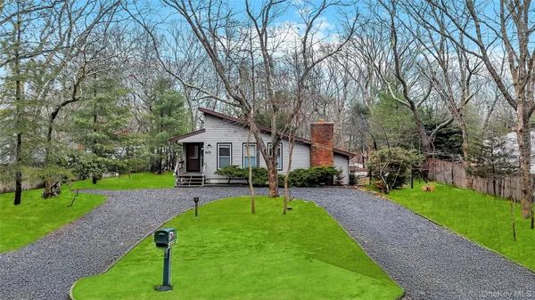 a view of a house with a yard porch and sitting area