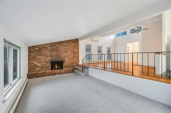 a view of livingroom with furniture and a fireplace