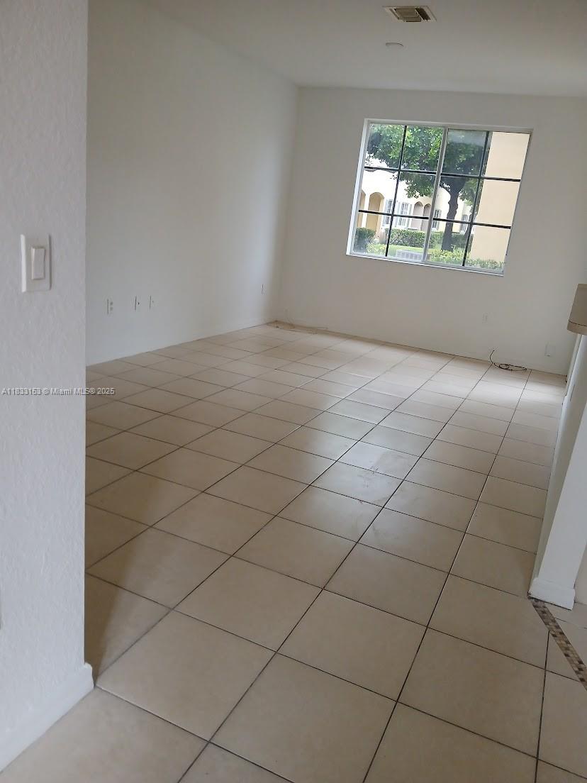 1909 Southwest 60th Avenue, Unit 1909 North Lauderdale, FL 33068 - Photo 15 of 19 an empty room with windows