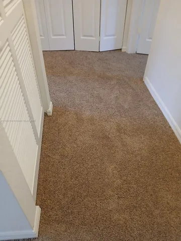 a view of entryway with kitchen