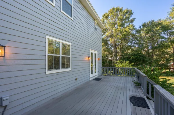 a view of a balcony with wooden floor