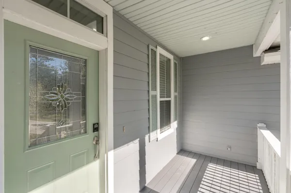 a bathroom with a glass door shower and a sink