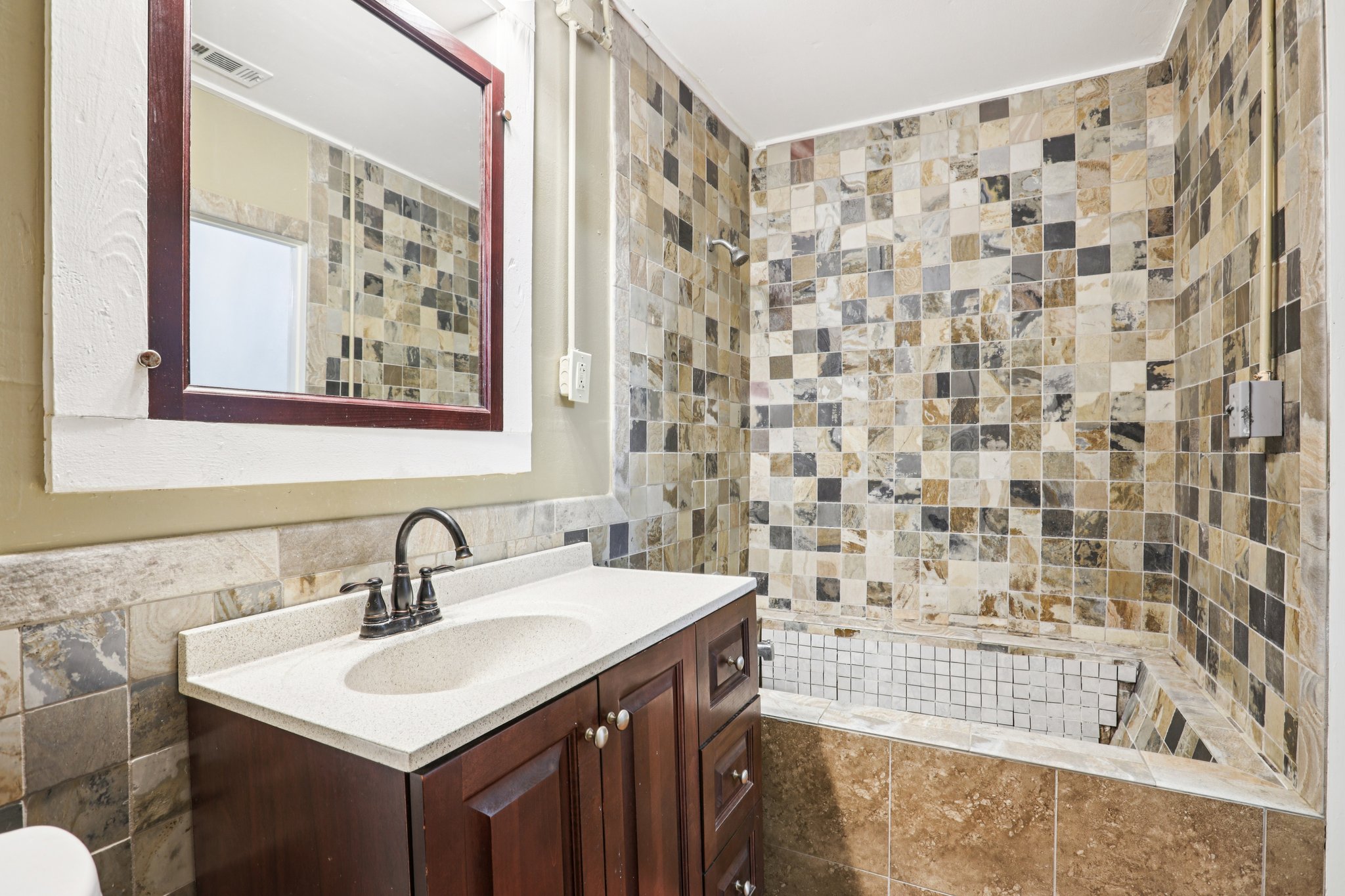 1801 Candee Street Georgetown, TX 78626 - Photo 6 of 14 a bathroom with a sink a toilet and a shower curtain