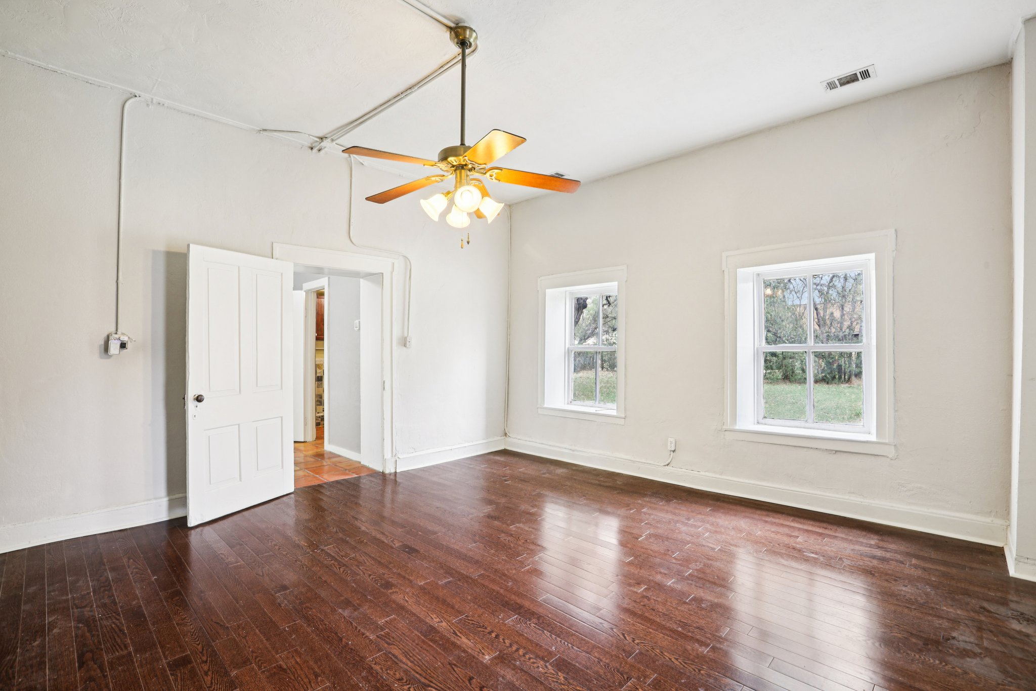 1801 Candee Street Georgetown, TX 78626 - Photo 7 of 14 a view of an empty room with window and wooden floor