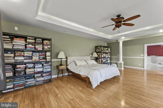 a bedroom with a bed furniture and a window