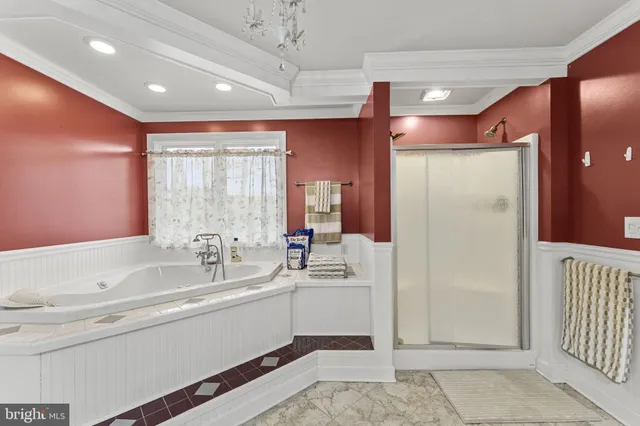 a bathroom with a sink mirror vanity and bathtub