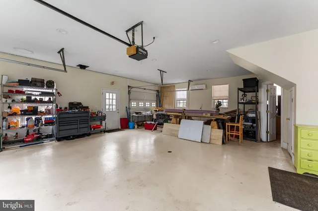 a living room with lots of furniture and a flat screen tv