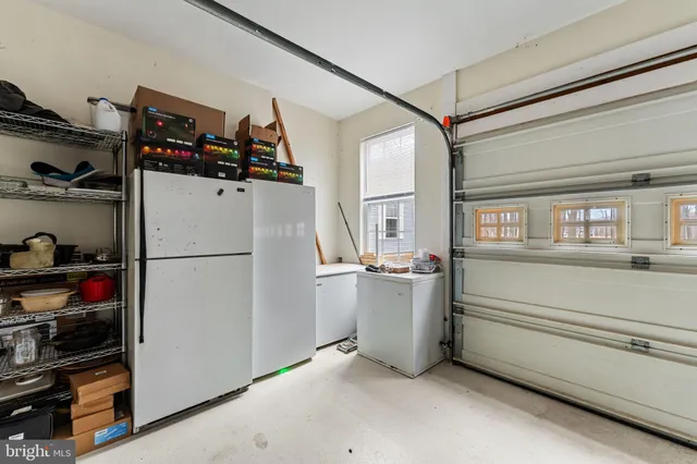 a storage and utility room with washer and dryer