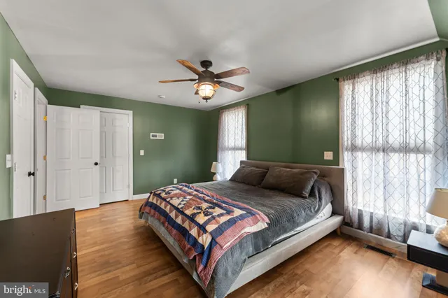 a bedroom with a bed and window