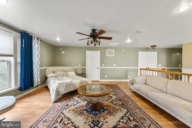 a bed room with furniture and a rug