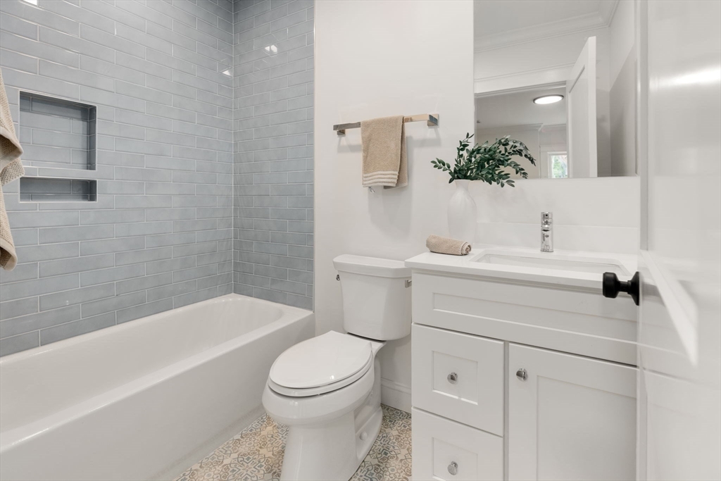 82 Deer Path Lane Weston, MA 02493 - Photo 37 of 42 a bathroom with a sink a toilet and bathtub