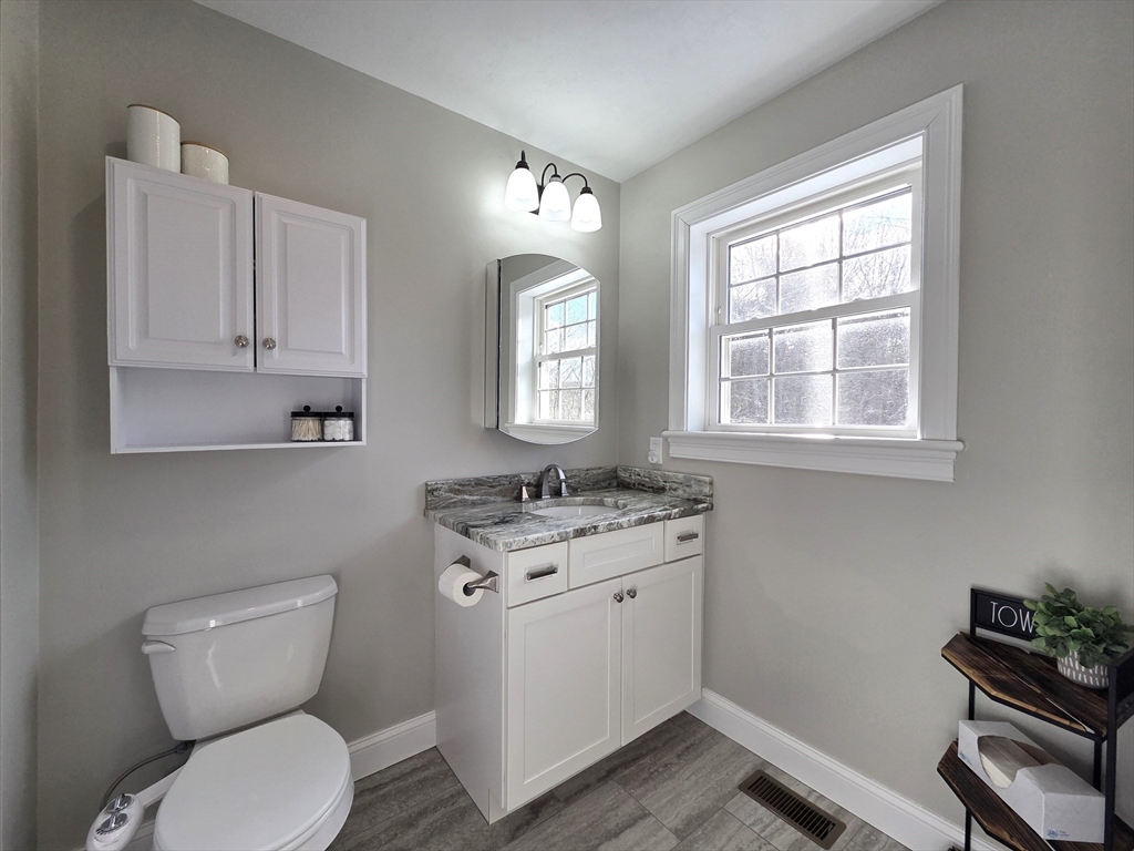 29 Lake Road Brookfield, MA 01506 - Photo 15 of 36 a bathroom with a toilet a sink and a window