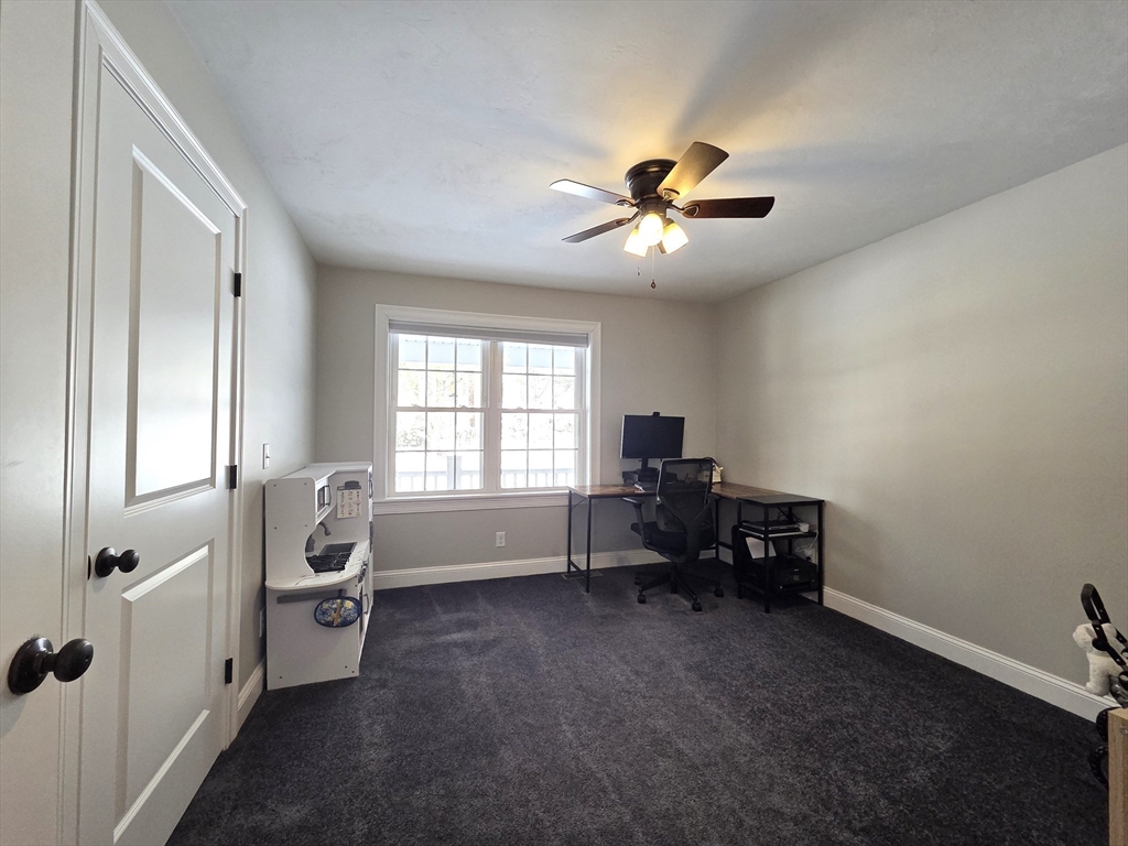29 Lake Road Brookfield, MA 01506 - Photo 19 of 36 a living room with furniture and a window
