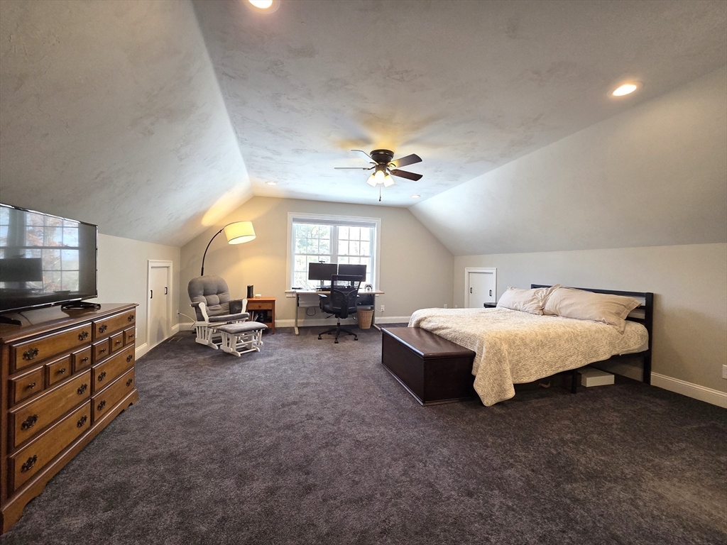 29 Lake Road Brookfield, MA 01506 - Photo 23 of 36 a spacious bedroom with a bed and large windows