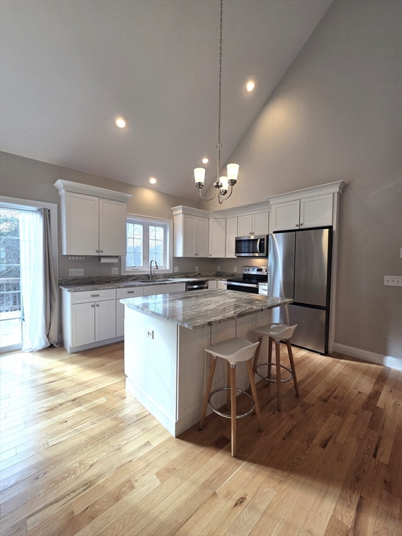 29 Lake Road Brookfield, MA 01506 - Photo 6 of 36 a kitchen with kitchen island granite countertop a sink cabinets and stainless steel appliances