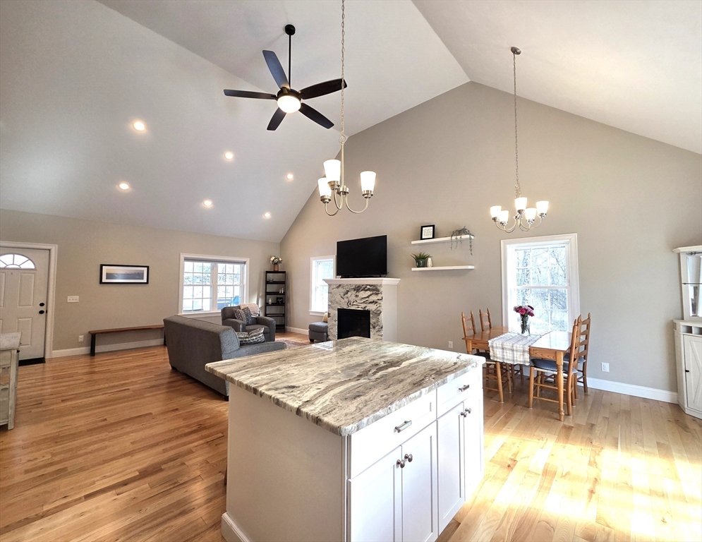 29 Lake Road Brookfield, MA 01506 - Photo 7 of 36 a living room with stainless steel appliances kitchen island furniture and a flat screen tv